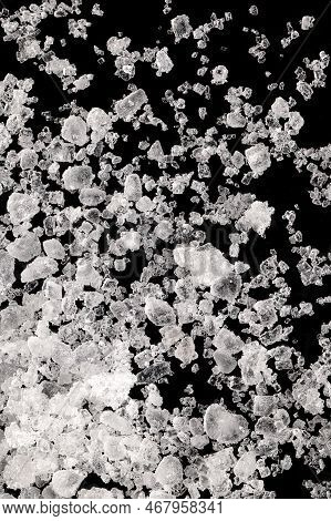 Sea Salt, Fleur De Sel, Close-up Of Crystals On A Black Surface. Also Flor De Sal, A Salt That Forms