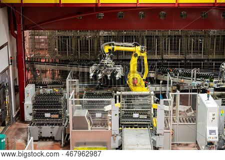 Production Of Cremant Sparkling Wine In Burgundy, France. Automatically Powered Bottling Lines On Fa