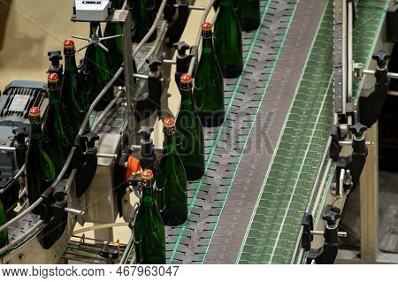 Production Of Cremant Sparkling Wine In Burgundy, France. Automatically Powered Bottling And Corking