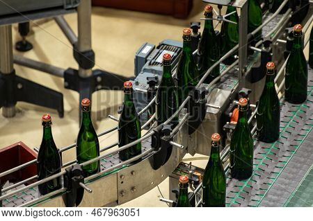 Production Of Cremant Sparkling Wine In Burgundy, France. Automatically Powered Bottling And Corking