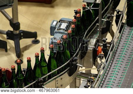 Production Of Cremant Sparkling Wine In Burgundy, France. Automatically Powered Bottling And Corking
