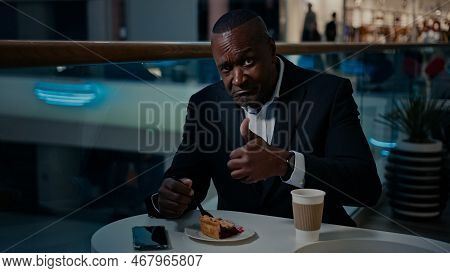 Ethnic Middle-aged Businessman Entrepreneur Cafe Visitor Eating Pie Enjoy Tasty Taste Showing Thumb 
