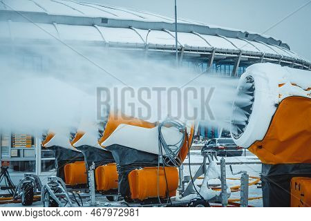 Snow Cannons Spray Artificial Snow Crystals. Production Of Artificial Snow. Cars Make Snow. Snow Gun