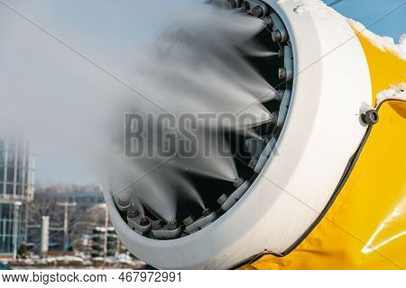 Snow Cannon Sprays Artificial Snow Crystals. Close-up. Production Of Artificial Snow. The Machine Ma