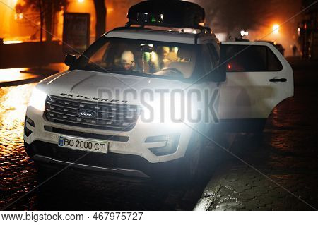 Ternopil, Ukraine- December, 24, 2022: Ford Explorer With Thule Motion Xt Xxl Rooftop Cargo Box In E