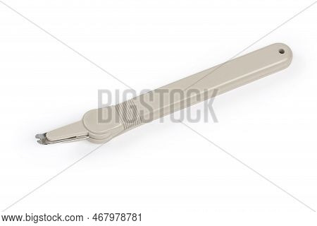 Simple Pen Type Staple Remover With The Ability To Hold Of Removed Staples, View On A White Backgrou