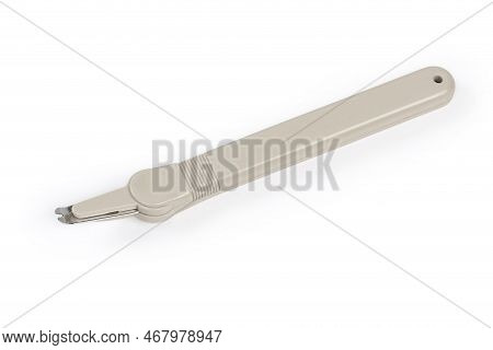 Simple Pen Type Staple Remover With The Ability To Hold Of Removed Staples, View On A White Backgrou