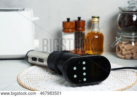 Thermal Immersion Circulator On Table In Kitchen, Closeup. Sous Vide Cooking