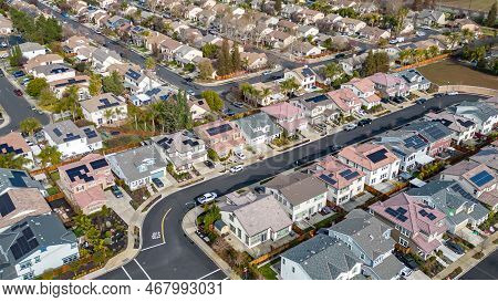 Top Down Aerial Photos Over A Community In California With Homes With Solar Panels And Roadways And