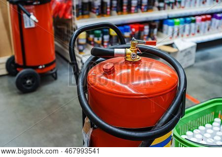 Large-sized Fire Extinguishers In The Sales Area Of The Store. Fire Fighting Equipment For Fire Exti