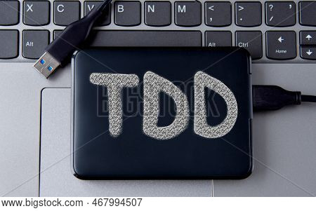 Tdd (telecommunications Device For The Deaf) - Acronym On An External Drive In Gray Letters On The B