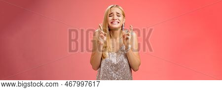 Nervous Hopeful Blond Young Woman In Silver Trendy Dress Close Eyes Grimacing Eager Wish Come True C