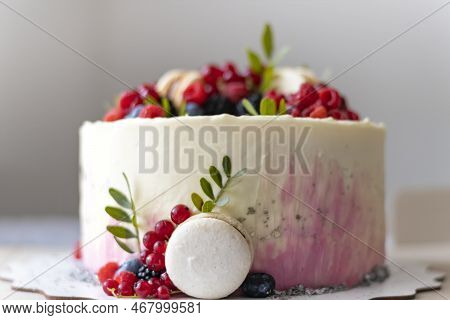 Delicious Fruit Cake With Decoration Of Berries And Macaroon. Dessert From Confectioner. Holiday Or 