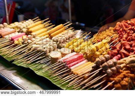 A Counter With Different Kinds Of Satey. Street Food Market In Thailand. Food On A Stick.