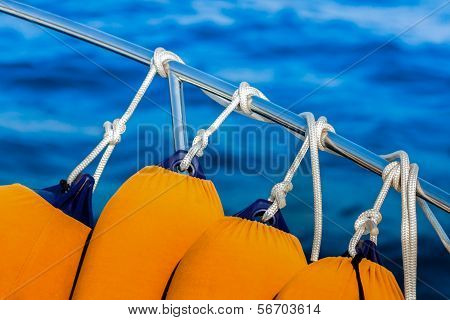 Fenders Anchored To The Guardrail