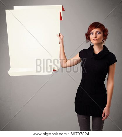Baeutiful young woman holding white origami paper copy space