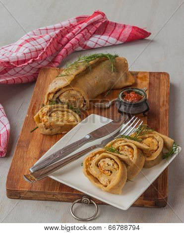 Steam Roll Stuffed With Meat On A Cutting Board