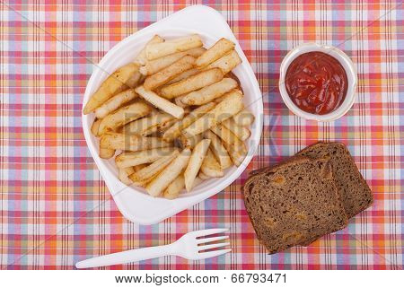 Fried Potatoes In A Plate On A Tablecloth.