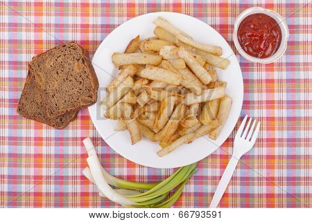 Fried Potatoes In A Plate On A Tablecloth.