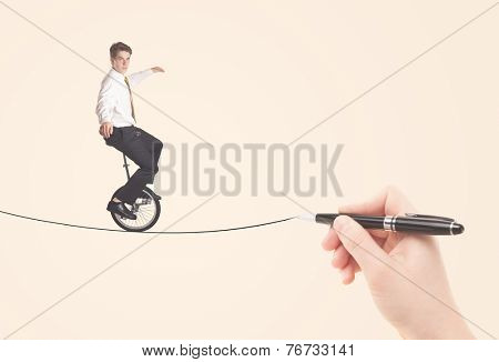 Businessman riding monocycle on a rope drawn by hand concept