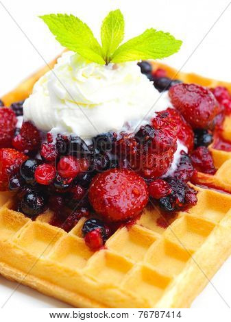 a selection of three italian gelato ice-cream scoops topped with nuts, chocolate, fruit served on crispy waffels