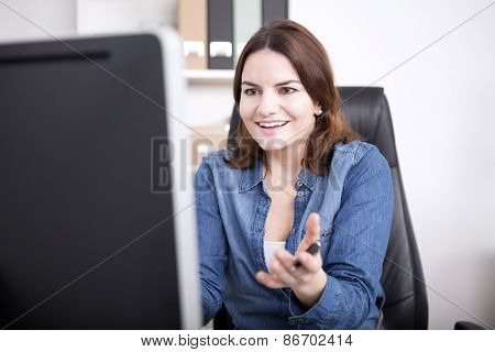 Surprised Businesswoman Facing At Computer Screen