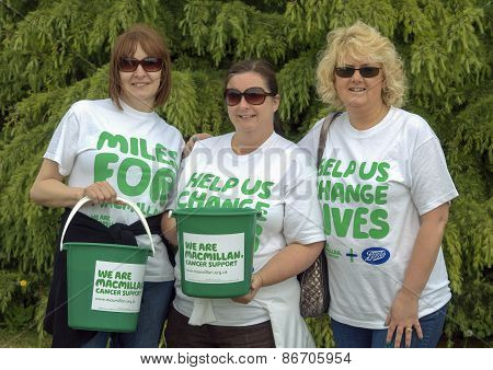 Three friends collecting money.