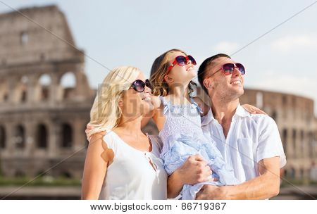 summer holidays, travel, tourism and people concept - happy family in rome over coliseum background