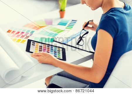 interior design, renovation and technology concept - woman working with color samples for selection