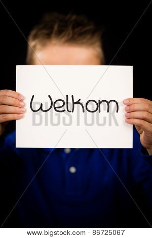 Child Holding Sign With Dutch Word Welkom - Welcome