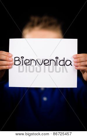 Child Holding Sign With Spanish Word Bienvenida - Welcome