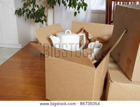 Moving boxes in new house. New apartment background.