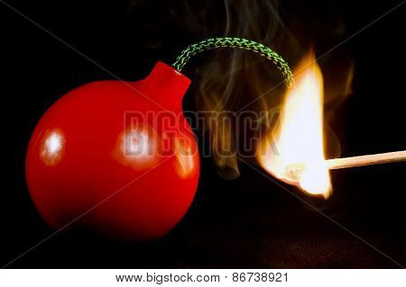 Flaming Match Lighting A Bomb