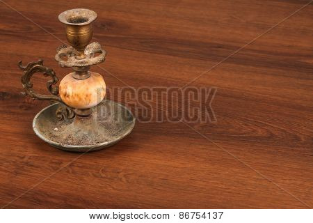 The Vintage Candlestick On The Wood