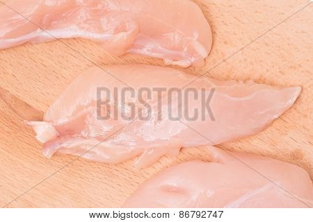 Chicken fillet on a wooden background