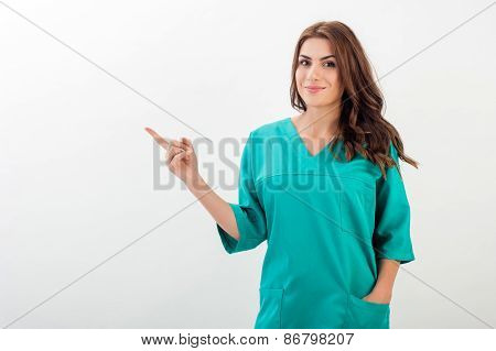 Portrait of young doctor  finger pointing