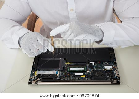 Technician Repairing Laptop