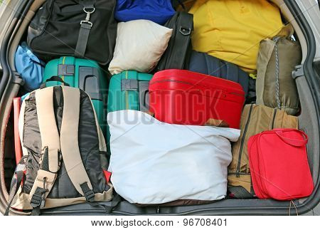 Trunk Of A Car Overloaded With Suitcases  For Family Travel