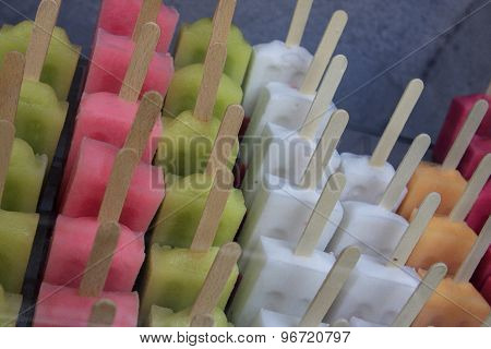 bunch of colourful ice creams on stick