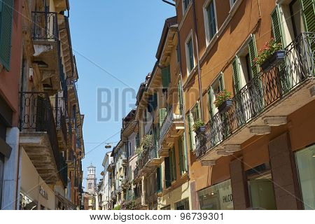VERONA, ITALY - JULY 11: Via Mazzini with Lamberti Tower in the far background. July 11, 2015 in Verona. Via Mazzini is one of the main commercial streets in Verona.