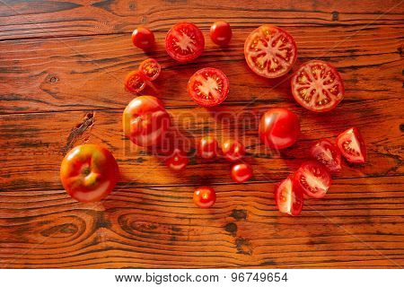 Tomatoes in a red monochrome rustic wooden table