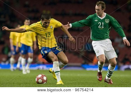 LONDON, ENGLAND. March 02 2010: Brazil's Luisao and Irelands Aiden McGeady during the international football friendly between Brazil and the Republic of Ireland played at the Emirates Stadium.
