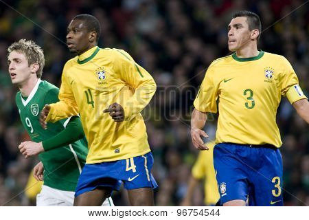 LONDON, ENGLAND. March 02 2010: Ireland's Kevin Doyle, Brazil's Juan (4) and Lucio (3) during the international football friendly between Brazil and the Republic of Ireland