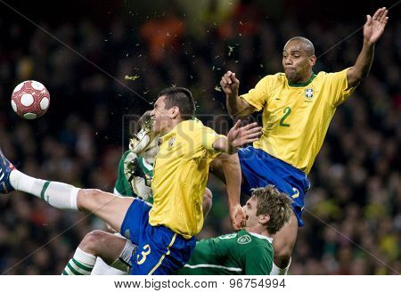 LONDON, ENGLAND. March 02 2010: Brazil's captain Lucio gets kicked in the head by Brazil's Maicon during the international football friendly between Brazil and the Republic of Ireland