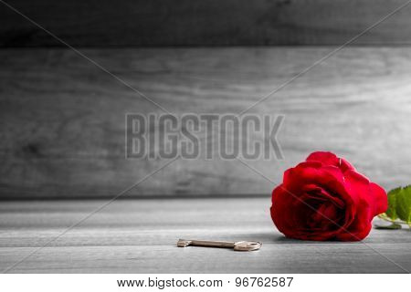 Beautiful Blooming  Red Rose And Key On Wooden Table