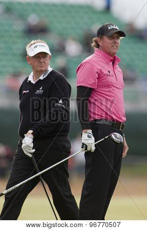 ST ANDREWS, SCOTLAND. July 15 2010: Colin MONTGOMERIE from Scotland (L) and Phil MICKELSON from USA (R) in action on the first day of The Open Championship   played on The Royal and Ancient Old Course