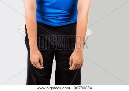 Teenager with empty pockets with a negative, depressed and discouraged posture
