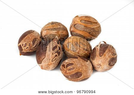 Close up and selective focus on a dried Nut Meg at foreground
