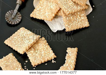 Homemade Rye Crackers With Sunflower Sesame On Black Background