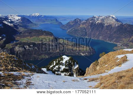 Spring in the Swiss Alps. View from mount Fronalpstock Stoos. Seelisberg and lake Vierwaldstattersee.